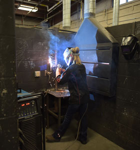 Two KISD Career center students welding